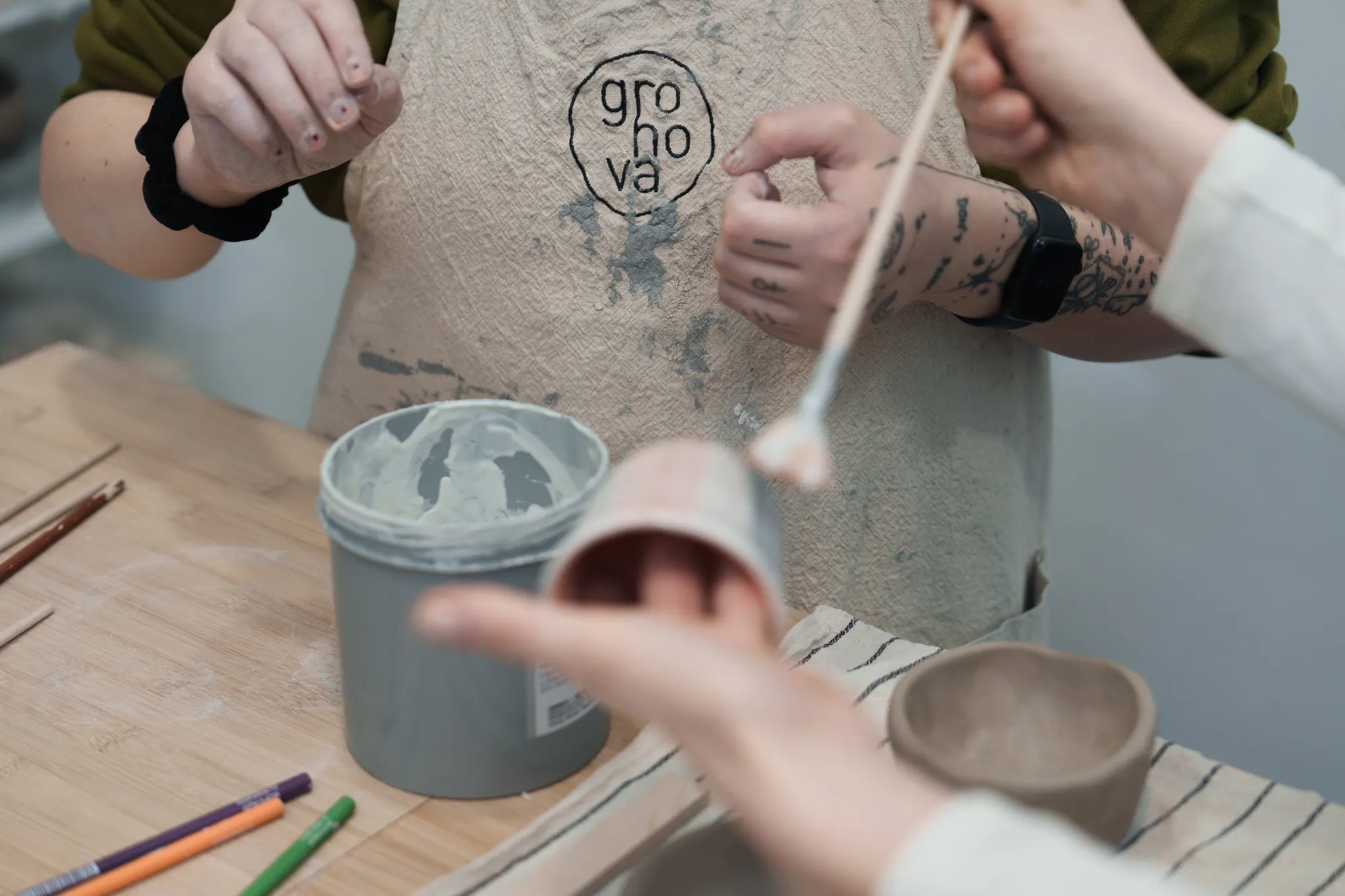 Working with clay at an Atelier Klei pottery class in Brno